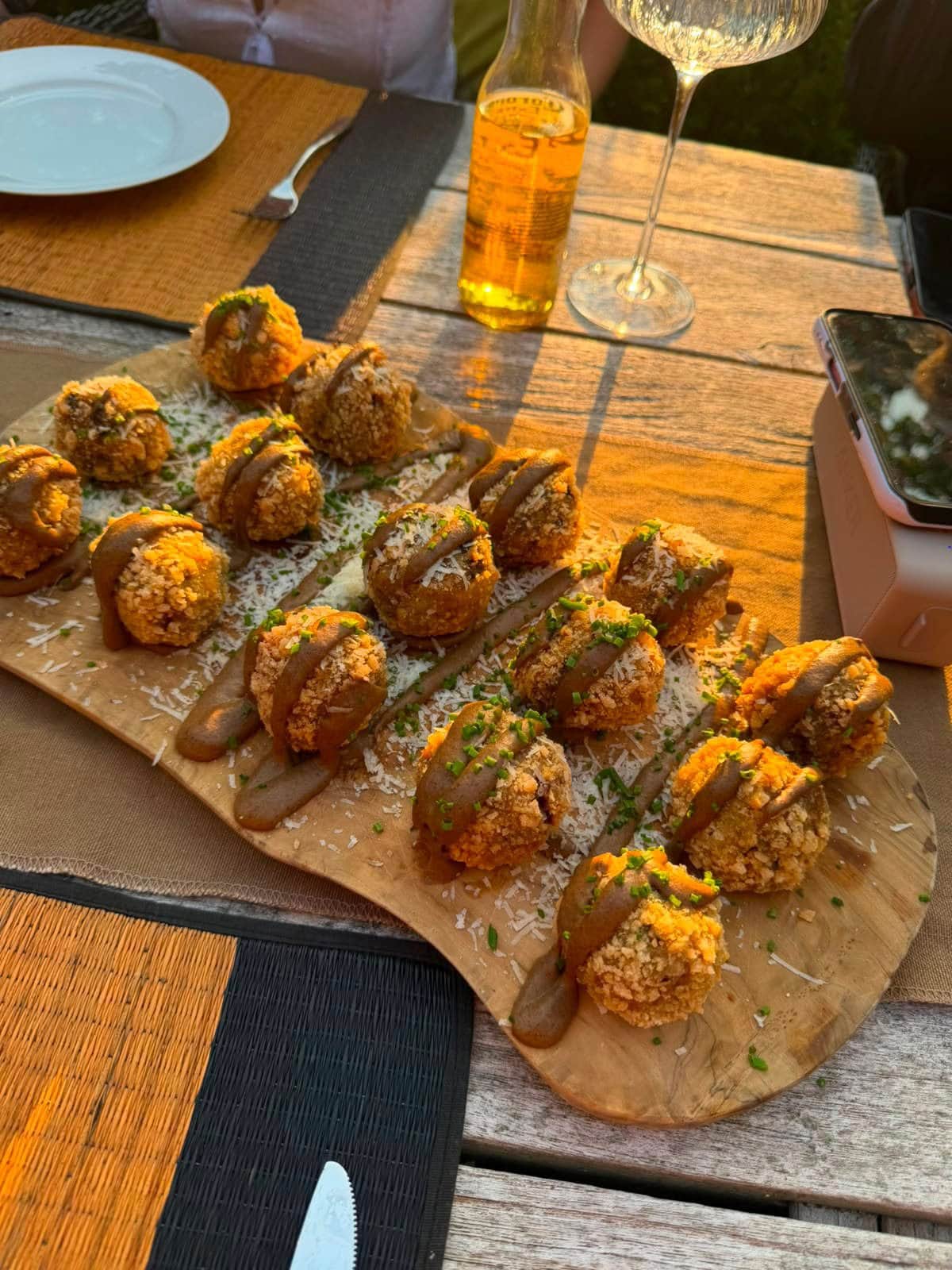 Crisp arancini finished with parmesan and sauce